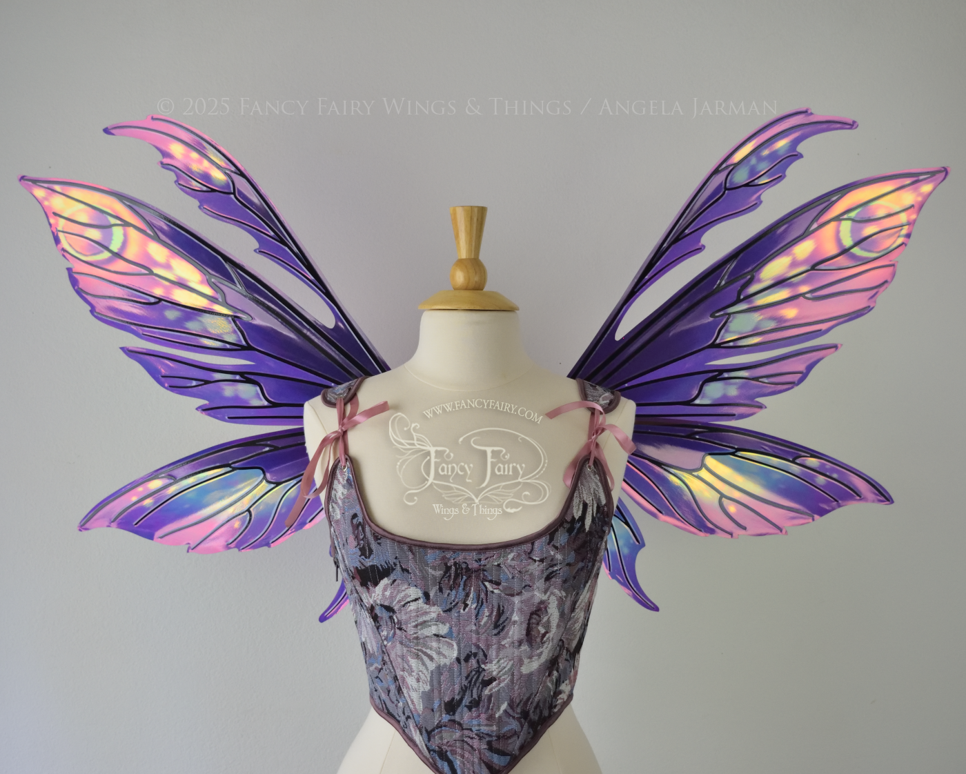 Purple & magenta iridescent fairy wings with antennae, black veins, worn on a dress form, front view