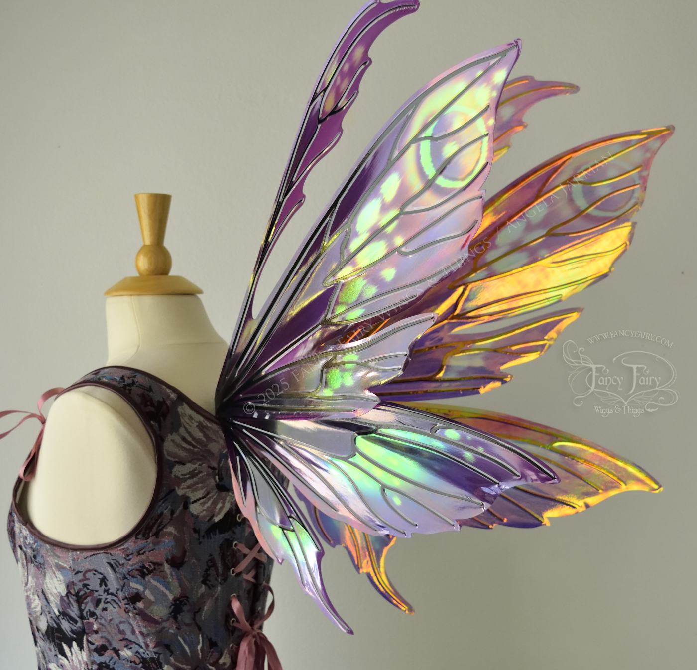 Purple & magenta iridescent fairy wings with antennae, black veins, worn on a dress form, back 3/4 view
