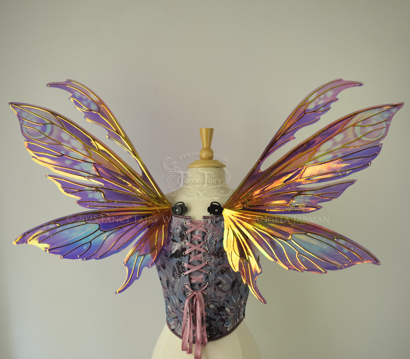 Purple & magenta iridescent fairy wings with antennae, black veins, worn on a dress form, back view