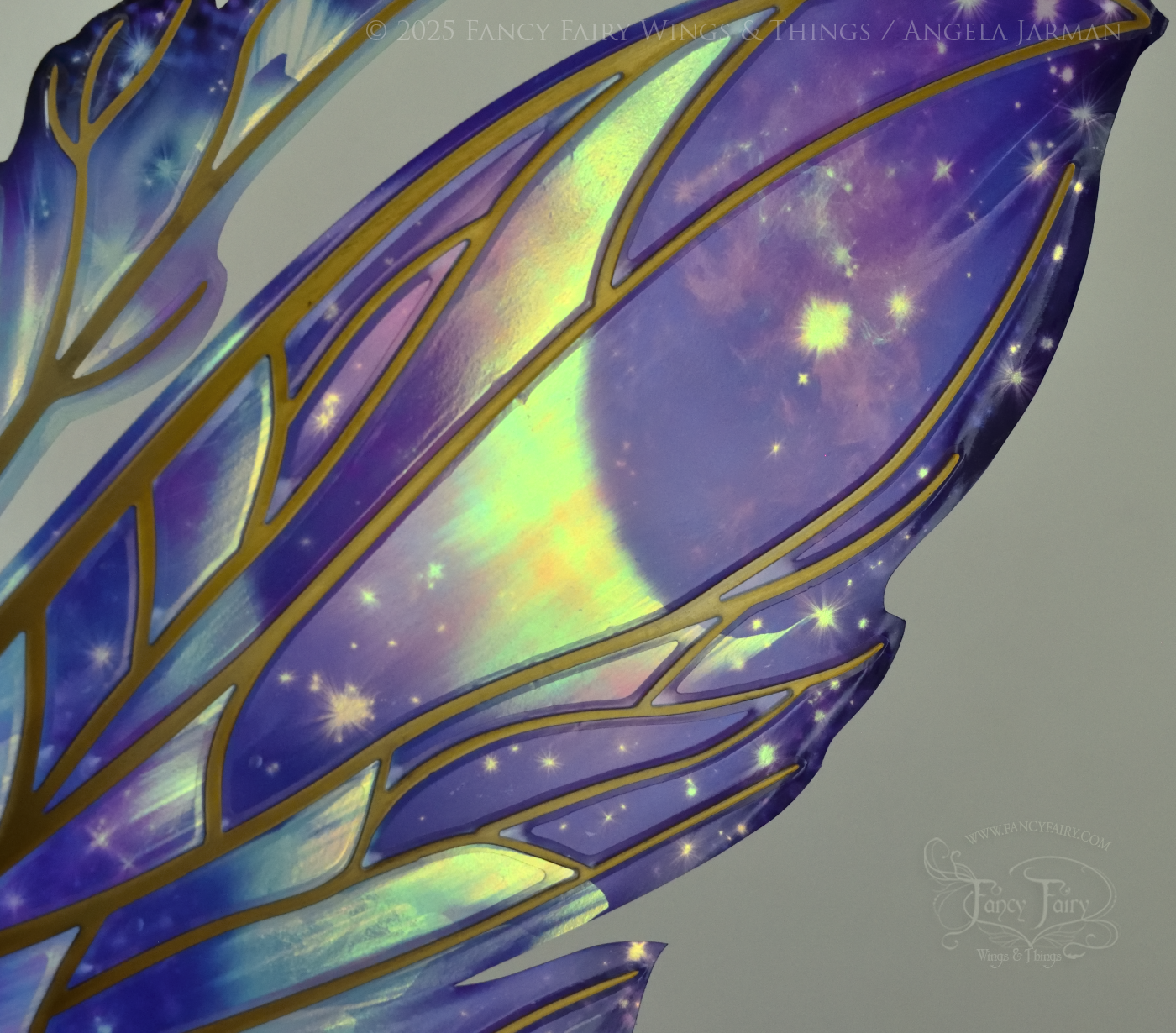 Closeup of iridescent fairy wings with a spacey night sky painted on them, with auroras, nebulae and stars, with gold veins