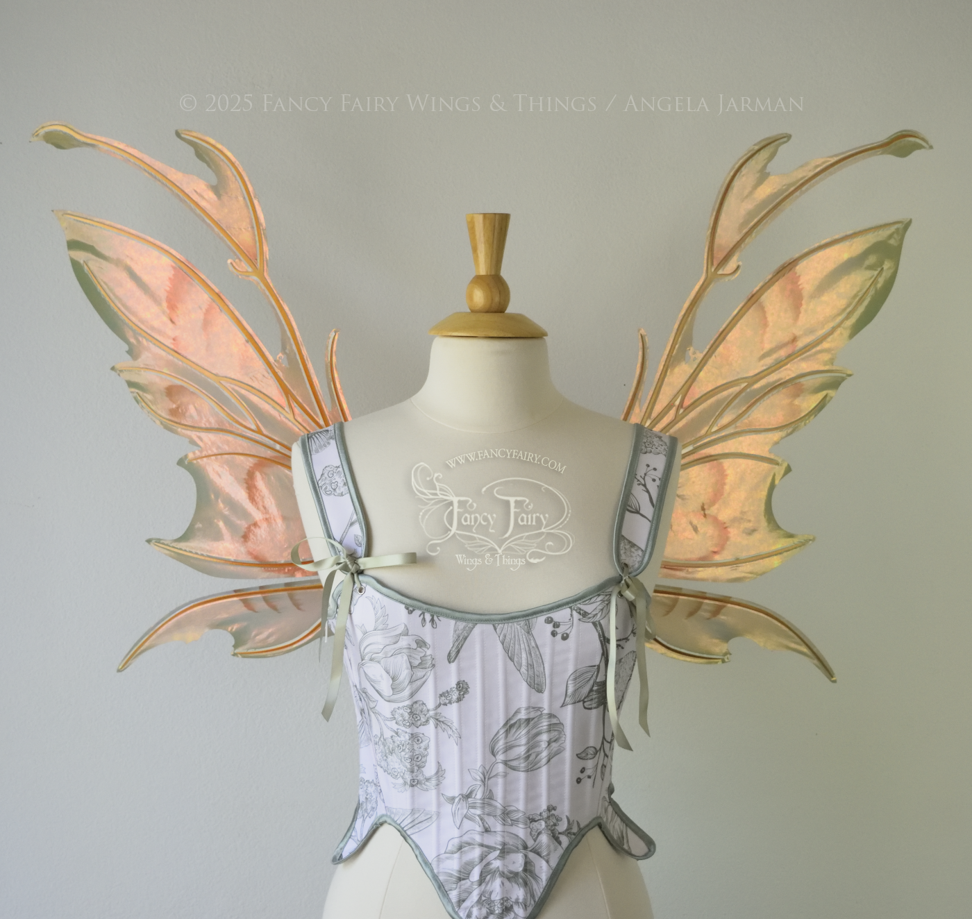 Rose Gold iridescent fairy wings with antennae and brown & olive green accents, copper veins, worn on a dress form, front view