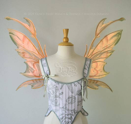 Rose Gold iridescent fairy wings with antennae and brown & olive green accents, copper veins, worn on a dress form, front view