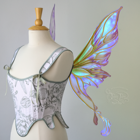 Iridescent & transparent purple & green fairy wings with gold veins and 2 swirling tails, worn on a dress form, right side view