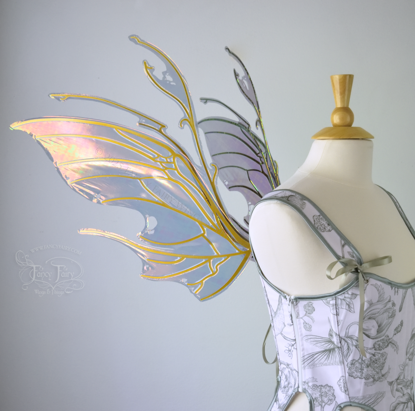 Beetle inspired iridescent orange, green & grey costume wings with antennae and gold veins, worn on a dress form, left side view