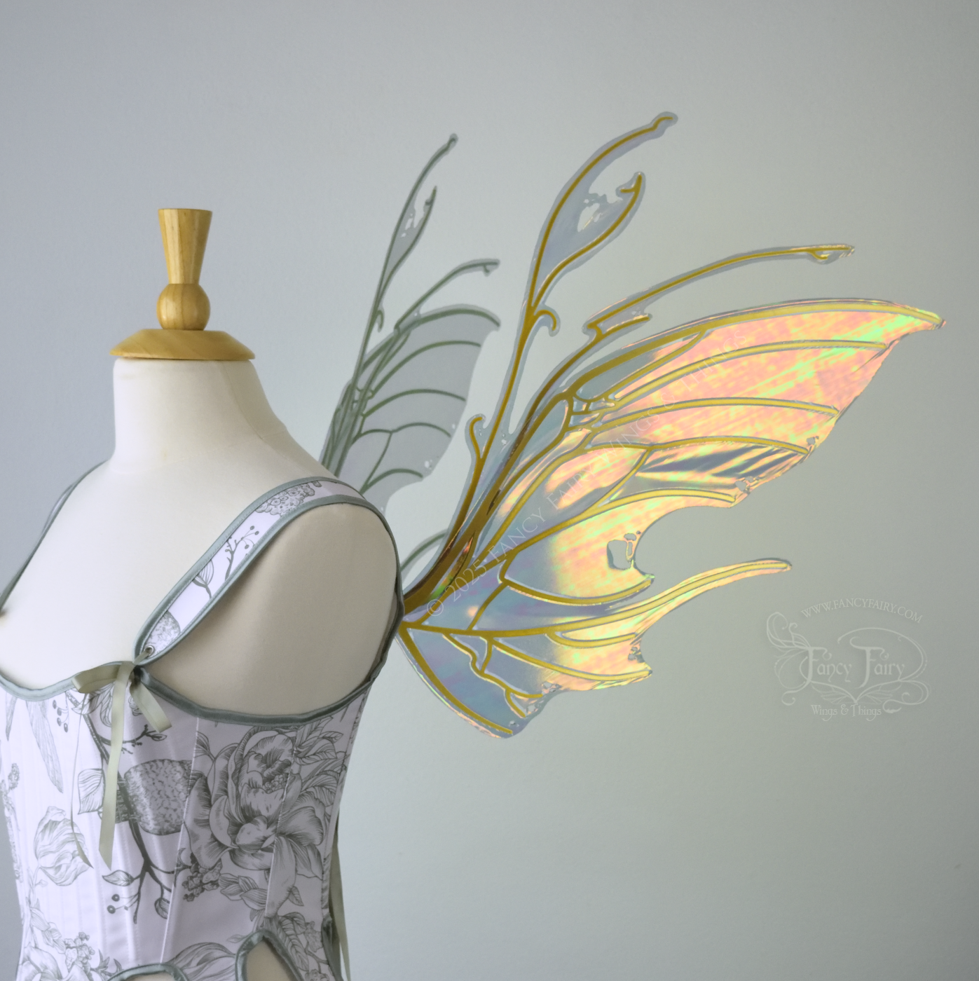 Beetle inspired iridescent orange, green & grey costume wings with antennae and gold veins, worn on a dress form, right side view