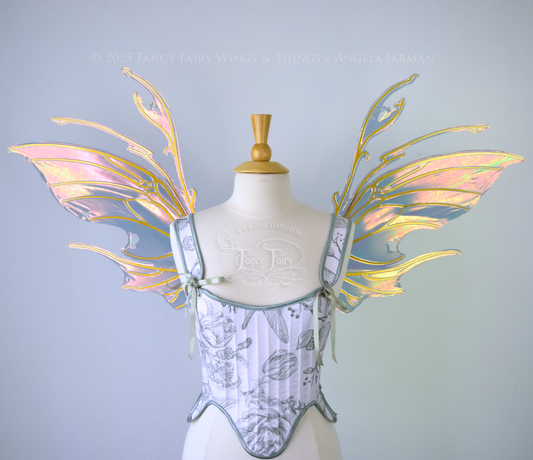 Beetle inspired iridescent orange, green & grey costume wings with antennae and gold veins, worn on a dress form, front view