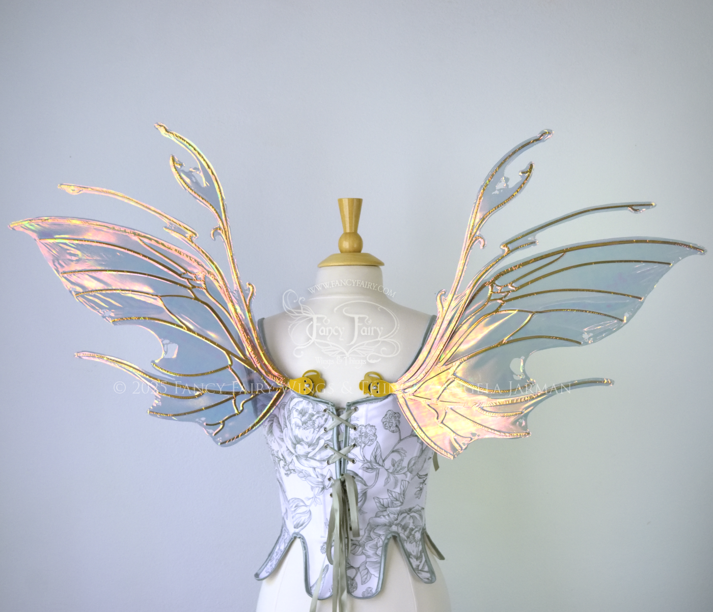 Beetle inspired iridescent orange, green & grey costume wings with antennae and gold veins, worn on a dress form, back view