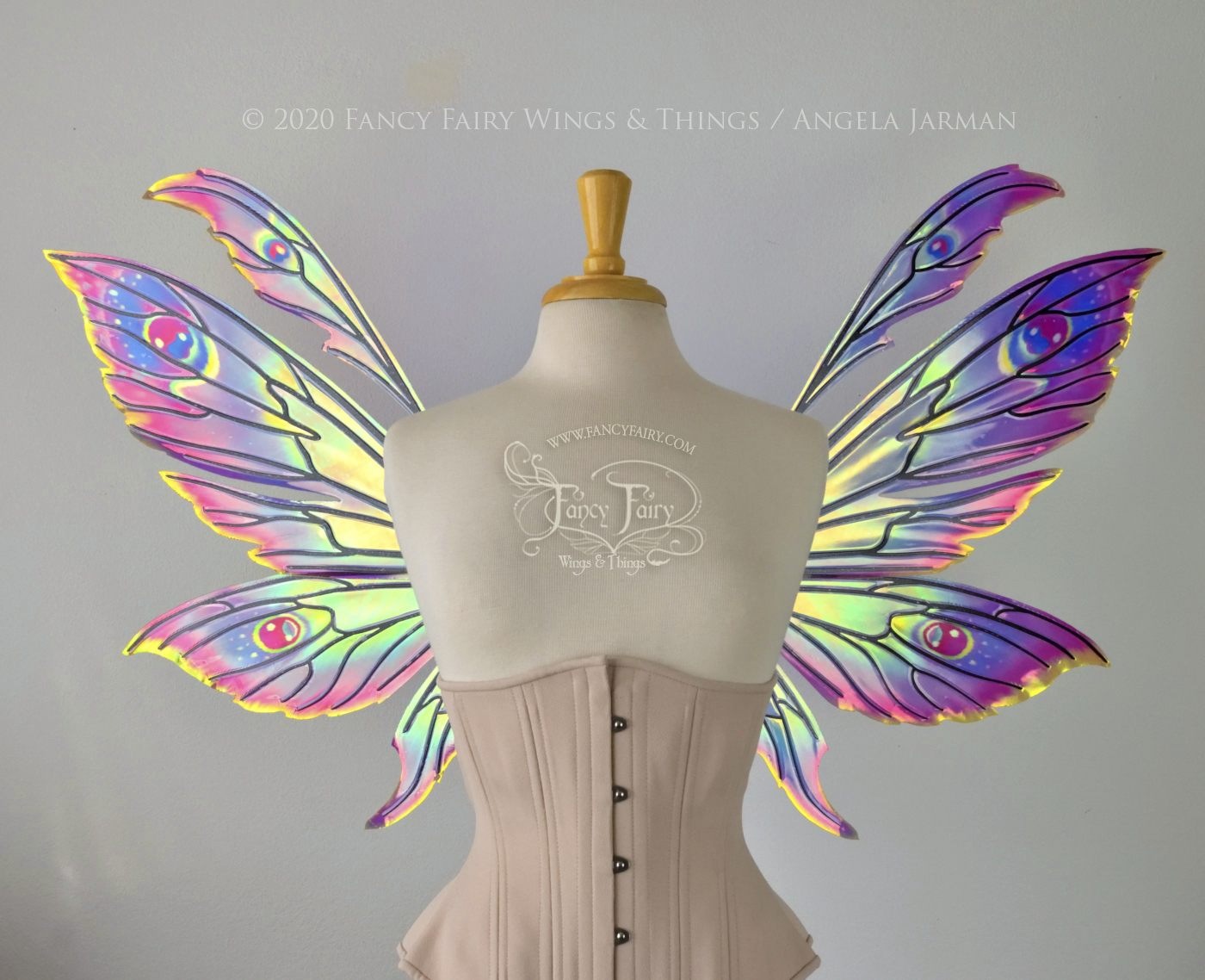 iridescent rainbow fairy wings with black veins, worn on a dress form, front view
