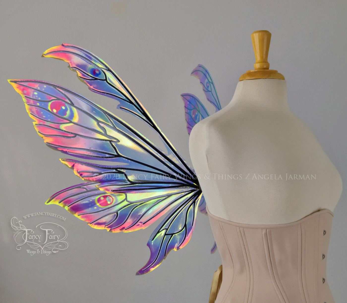 iridescent rainbow fairy wings with black veins, worn on a dress form, left side view