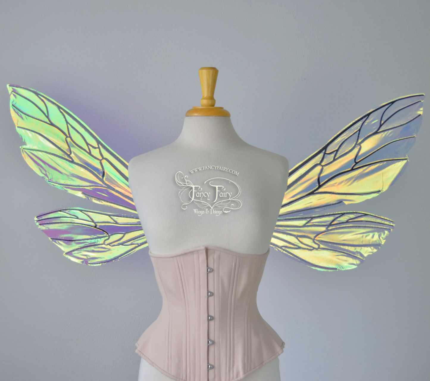 Transparent iridescent wasp-like fairy wings with black veins worn on a dress form, front view