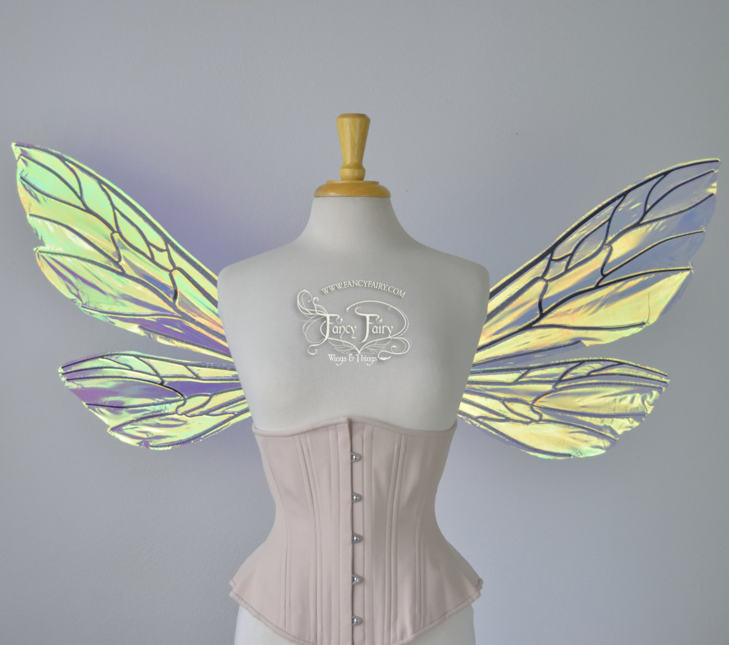 Transparent iridescent wasp-like fairy wings with black veins worn on a dress form, front view