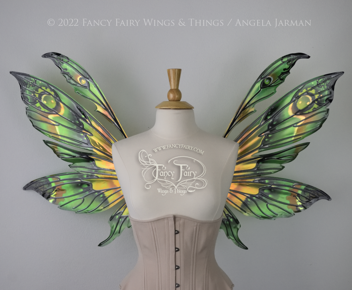 Green, black & brown iridescent steampunk fairy wings worn on a dress form, front view