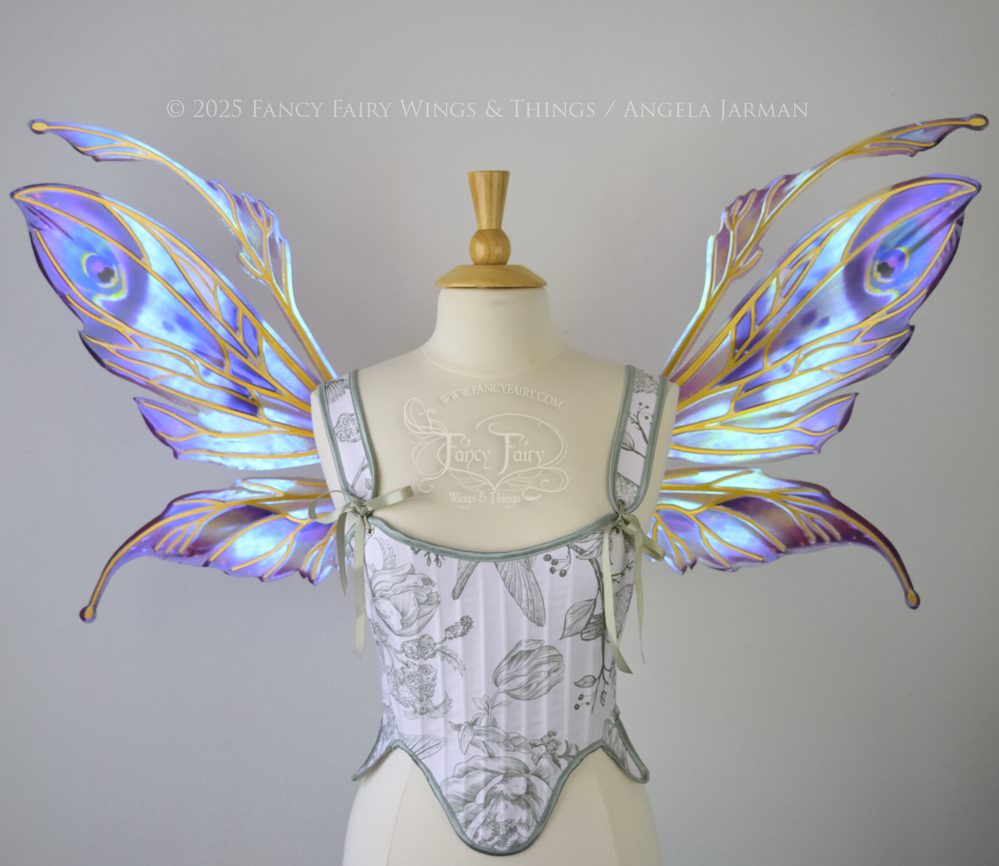 Large mauve, plum and blue iridescent fairy wings with antennae, gold veins, worn on a dress form, front view