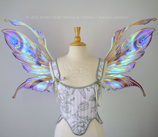 Large mauve, plum and blue iridescent fairy wings with antennae, gold veins, worn on a dress form, front view