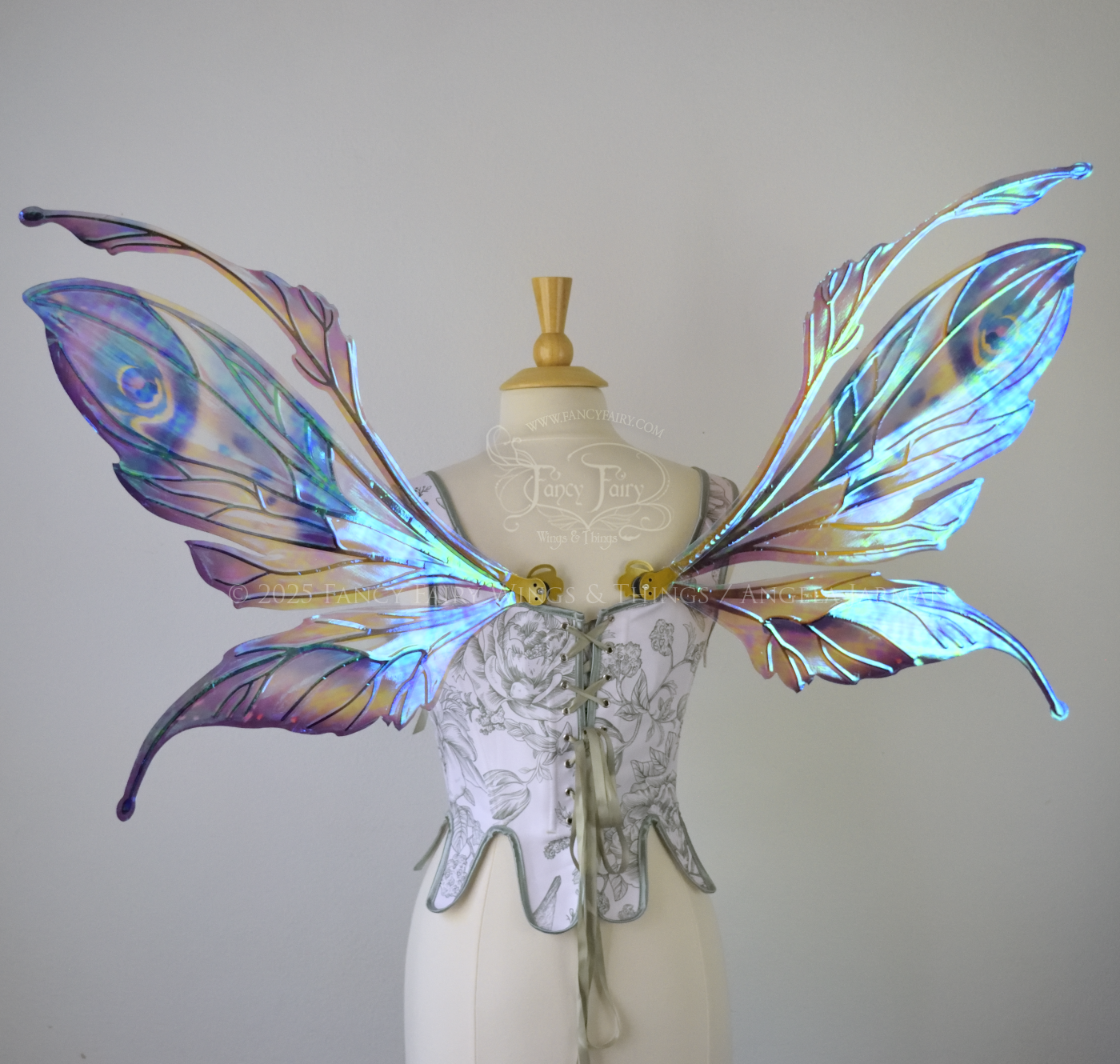Large mauve, plum and blue iridescent fairy wings with antennae, gold veins, worn on a dress form, back view