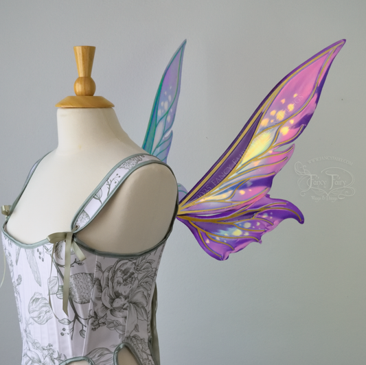 Iridescent elongated purple & fuchsia fairy wings with touches of blue and gold veins, right side view 