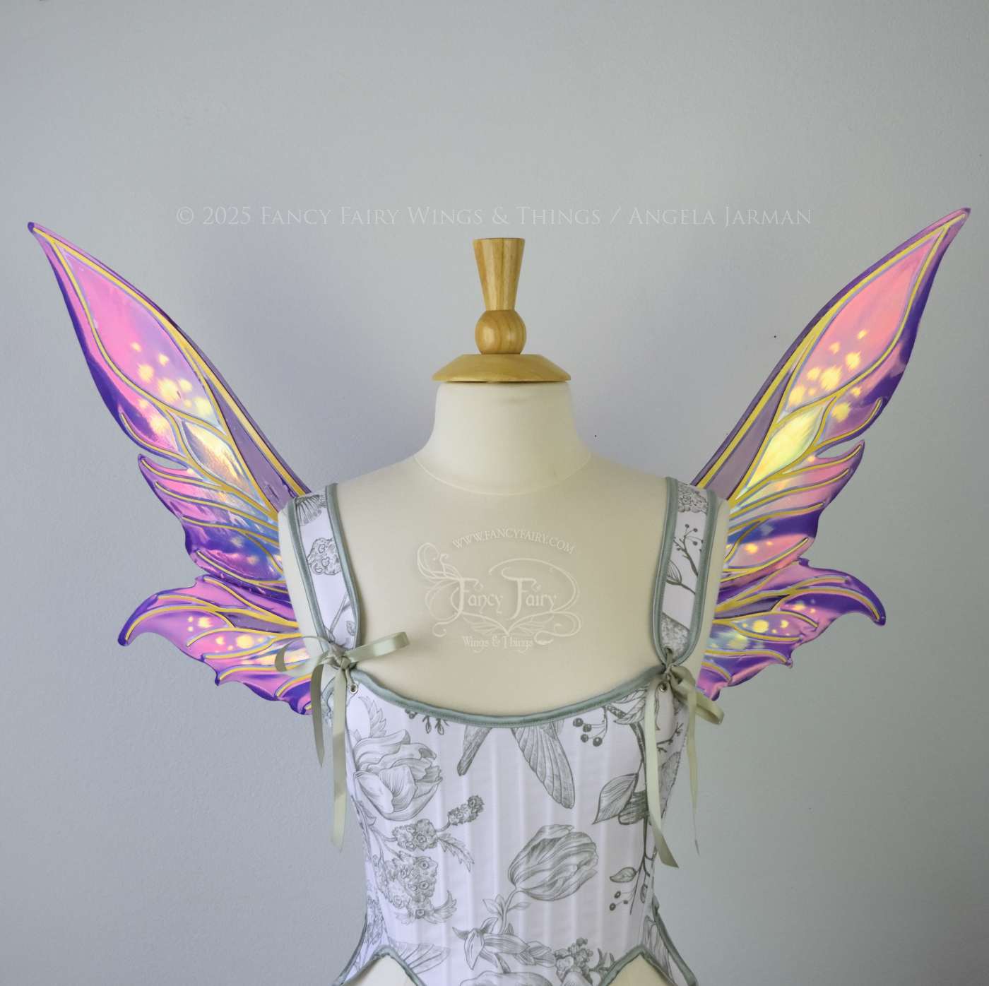 Iridescent elongated purple & fuchsia fairy wings with touches of blue and gold veins, front view 