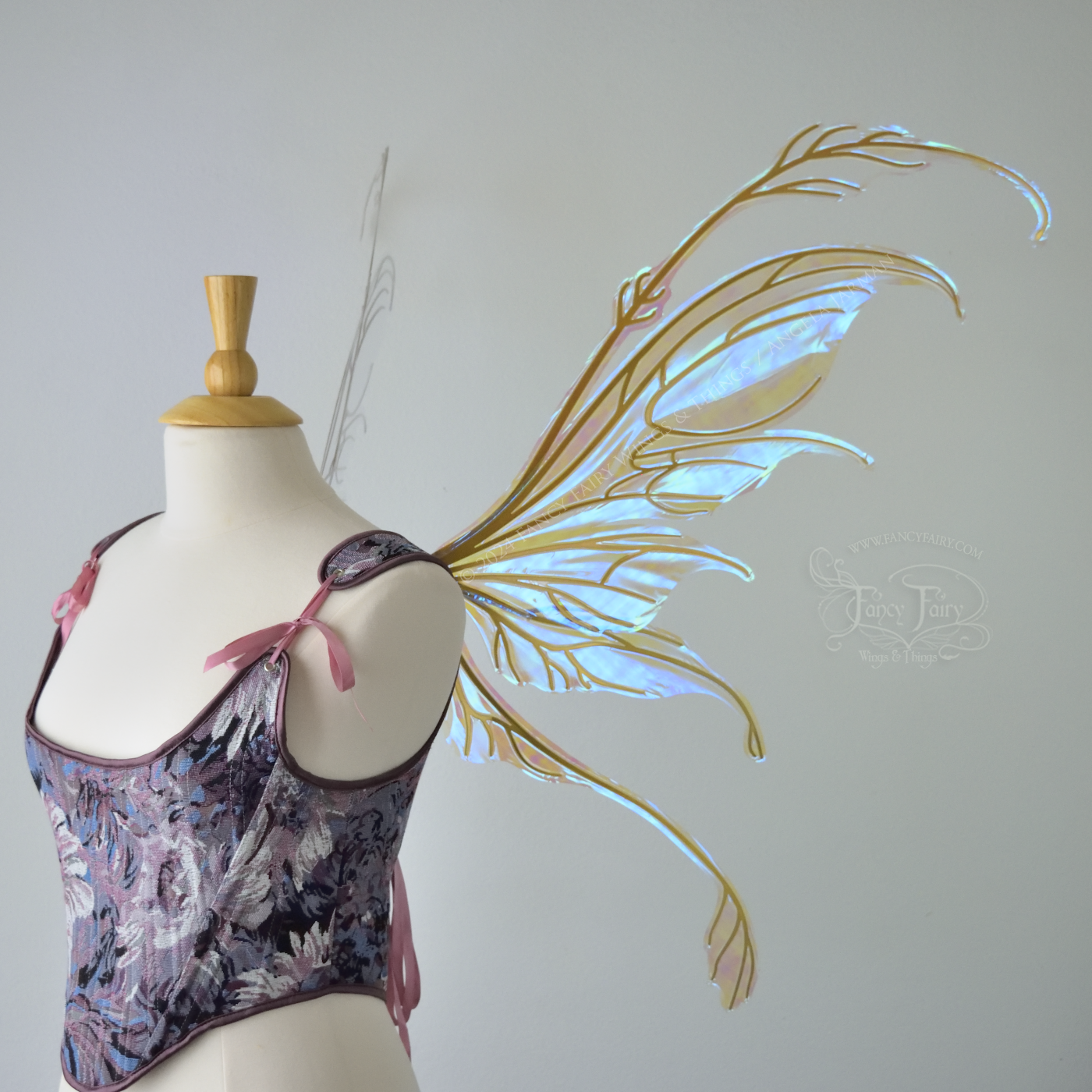 Large blue / green transparent iridescent fairy wings with downward curved tips, antennae & appendages, gold veins, worn on a dress form, right side view