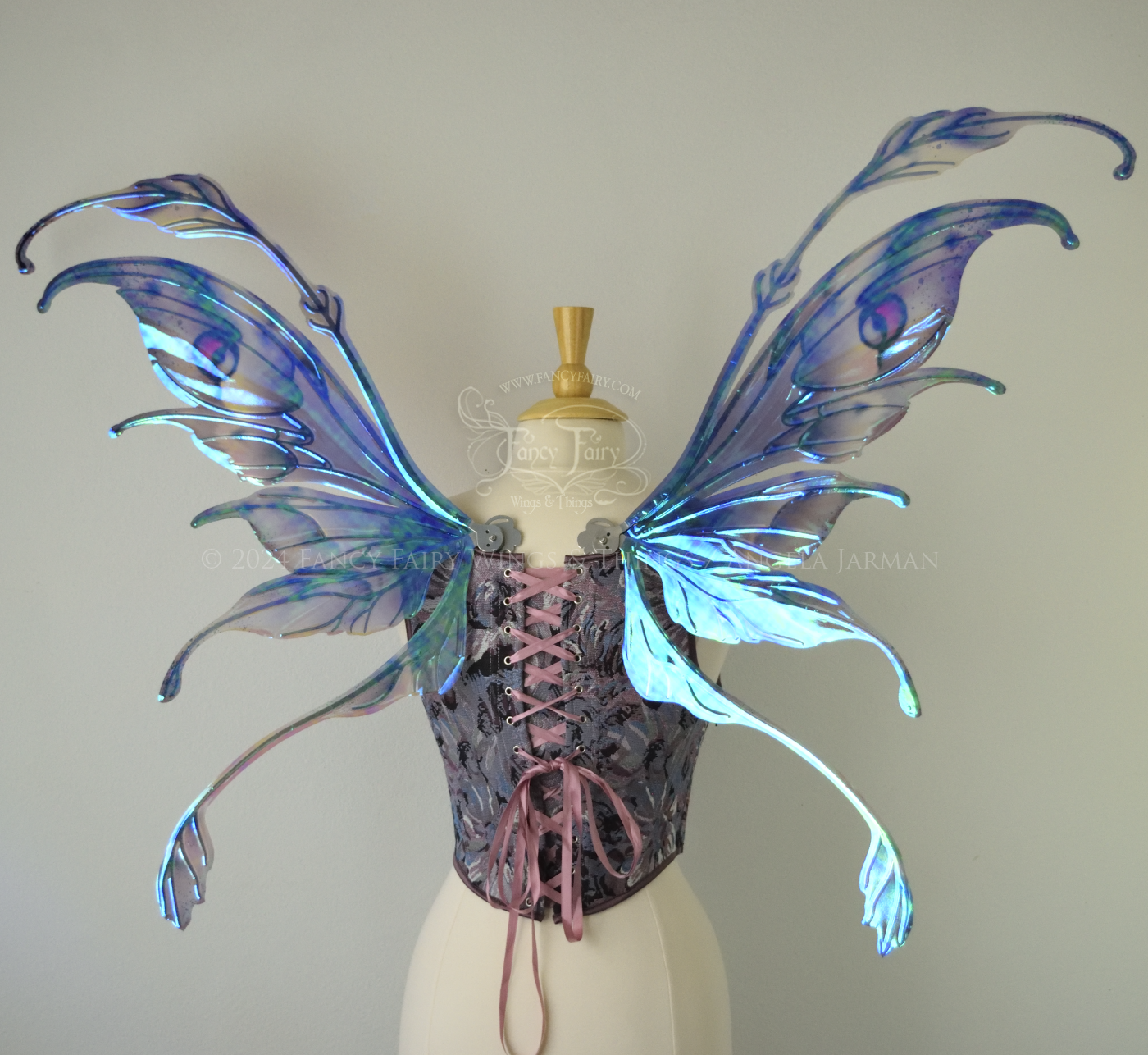 Iridescent fairy wings with antennae in purples, blues, and black with red accent and silver veins, back view