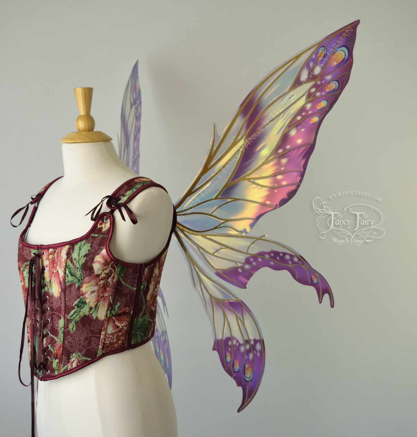 Large elongated iridescent fairy wings with burgundy, orange and blue accents & gold veins, 3 panels each side, worn on a dress form, right side view