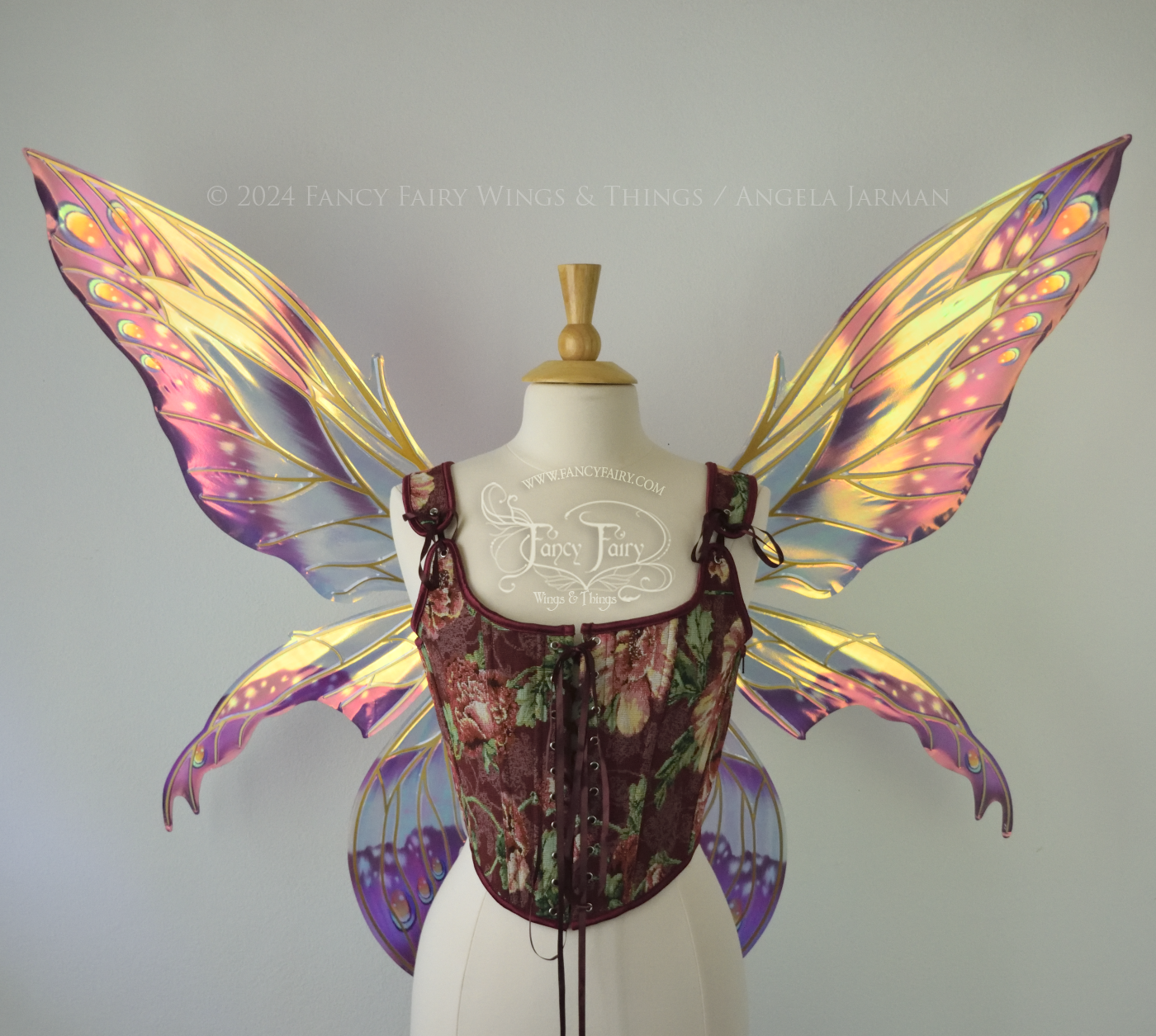 Large elongated iridescent fairy wings with burgundy, orange and blue accents & gold veins, 3 panels each side, worn on a dress form, front view