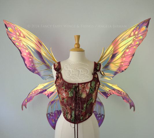 Large elongated iridescent fairy wings with burgundy, orange and blue accents & gold veins, 3 panels each side, worn on a dress form, front view