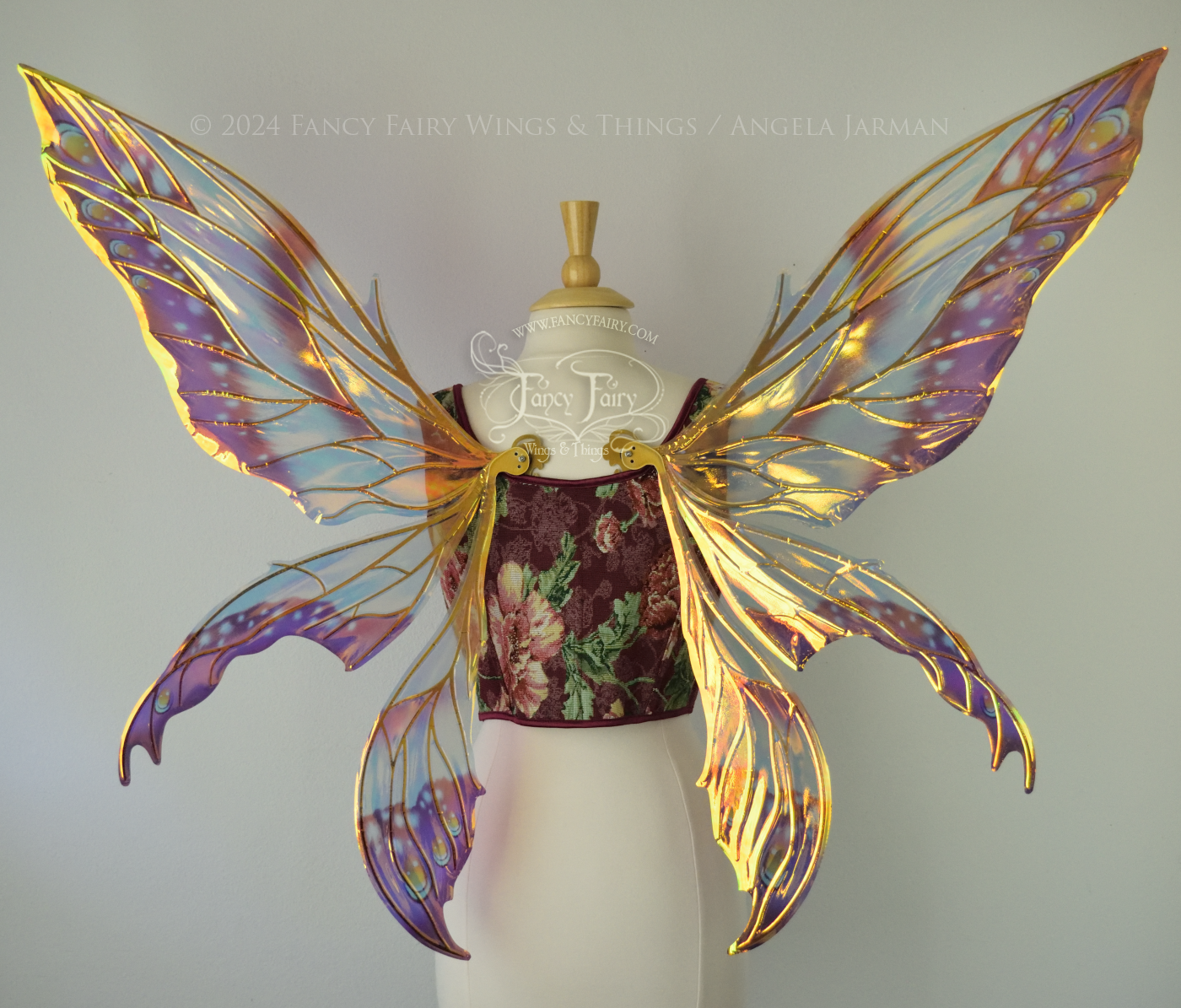 Large elongated iridescent fairy wings with burgundy, orange and blue accents & gold veins, 3 panels each side, worn on a dress form, back view