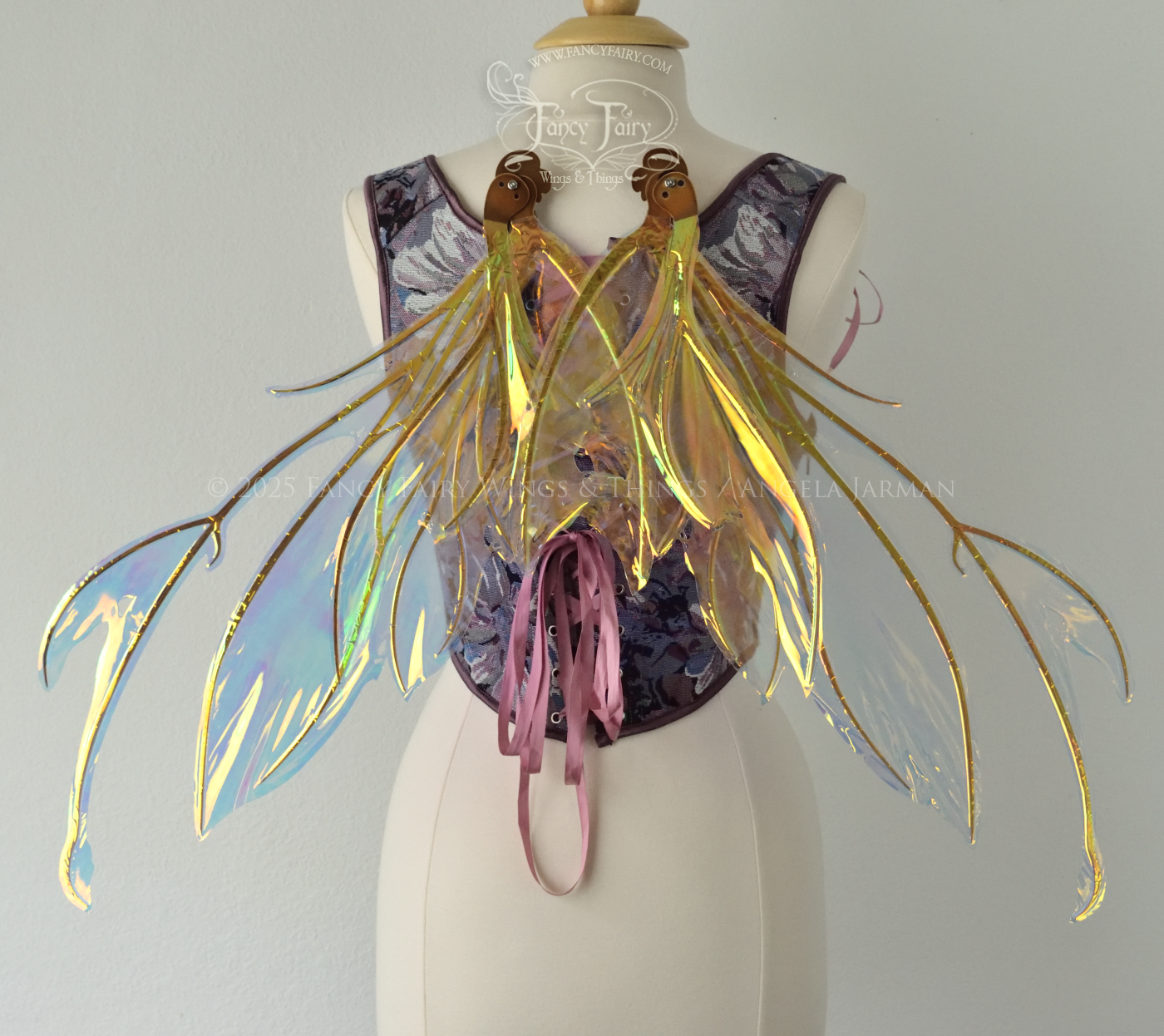 Iridescent & transparent bug-like fairy wings with antennae & copper veins, worn on a dress form, back view, in resting position