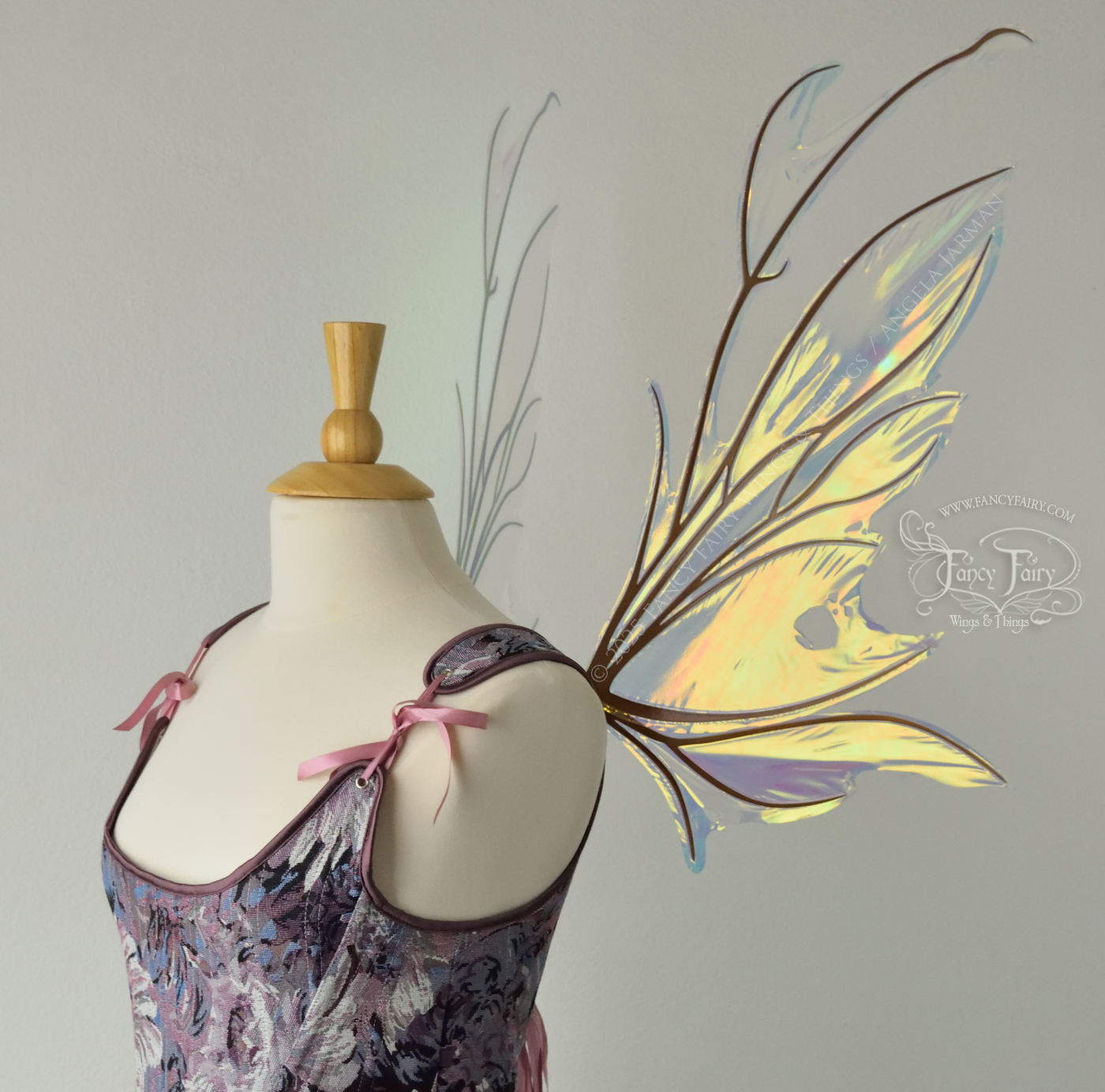 Iridescent & transparent bug-like fairy wings with antennae & copper veins, worn on a dress form, right side view