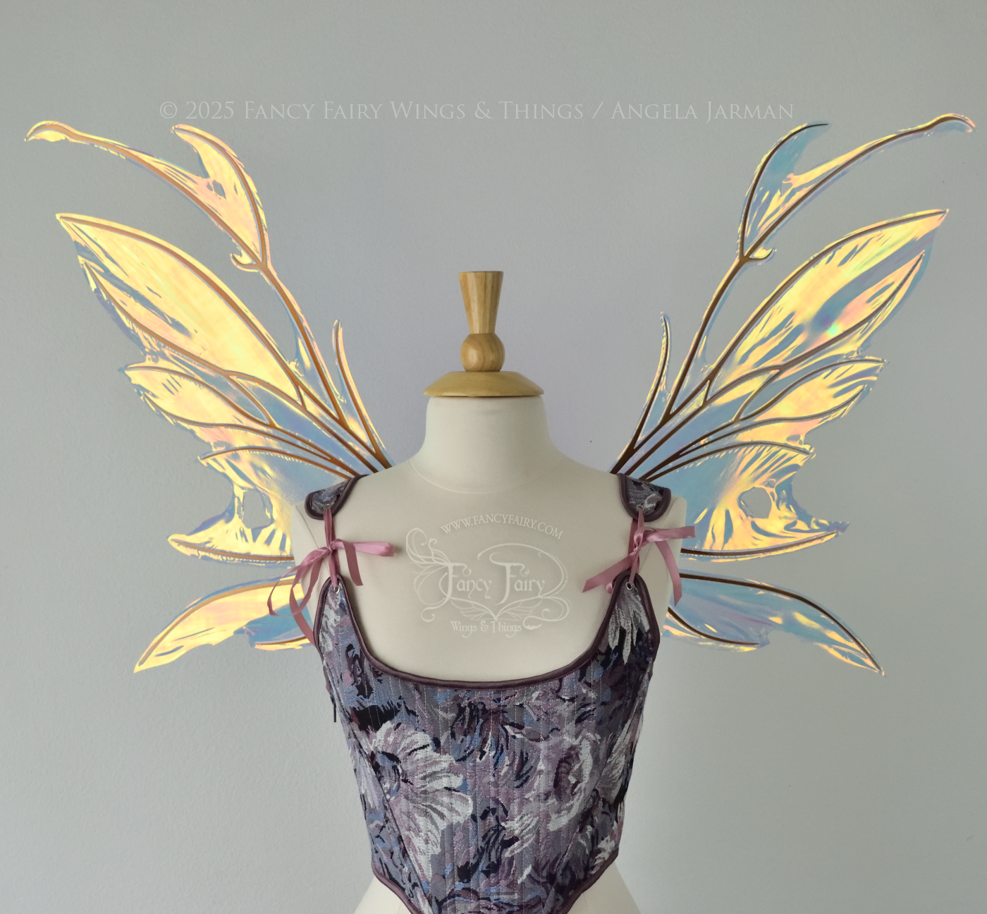 Iridescent & transparent bug-like fairy wings with antennae & copper veins, worn on a dress form, front view