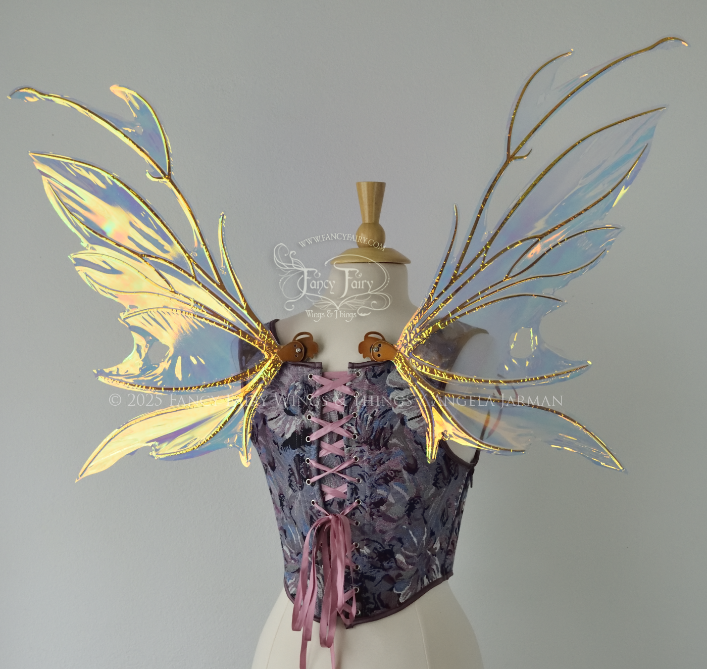 Iridescent & transparent bug-like fairy wings with antennae & copper veins, worn on a dress form, back view