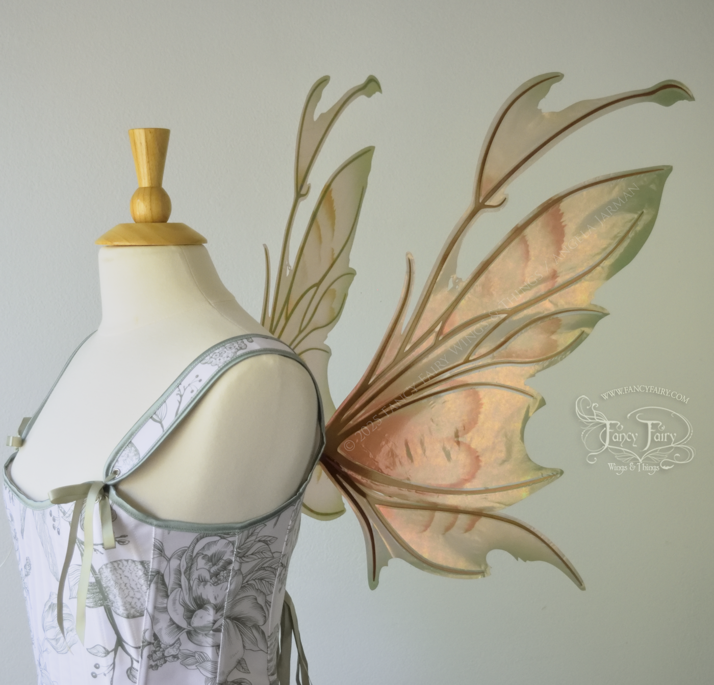 Rose Gold iridescent fairy wings with antennae and brown & olive green accents, copper veins, worn on a dress form, right side view