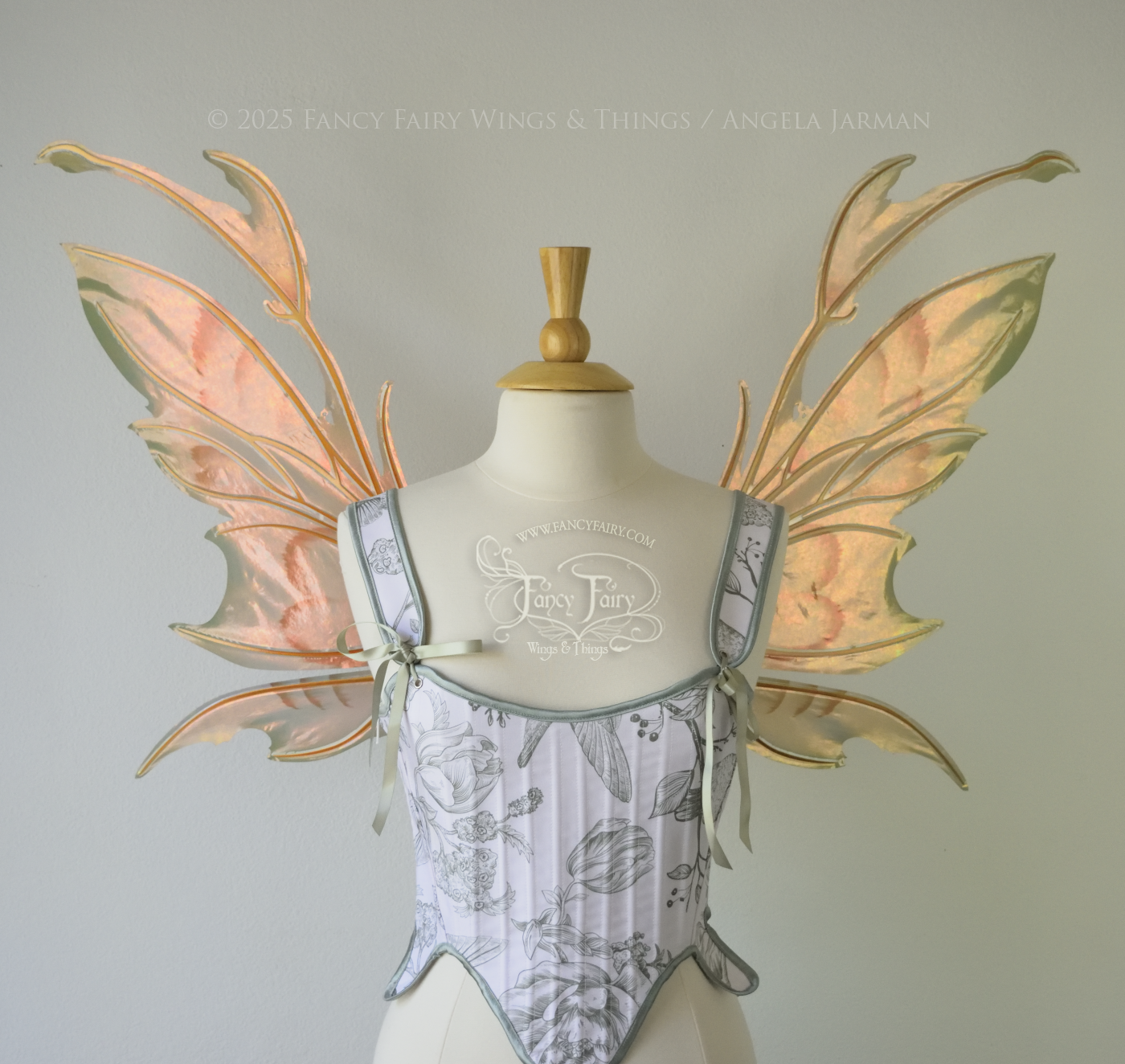 Rose Gold iridescent fairy wings with antennae and brown & olive green accents, copper veins, worn on a dress form, front view