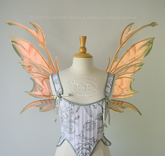 Rose Gold iridescent fairy wings with antennae and brown & olive green accents, copper veins, worn on a dress form, front view