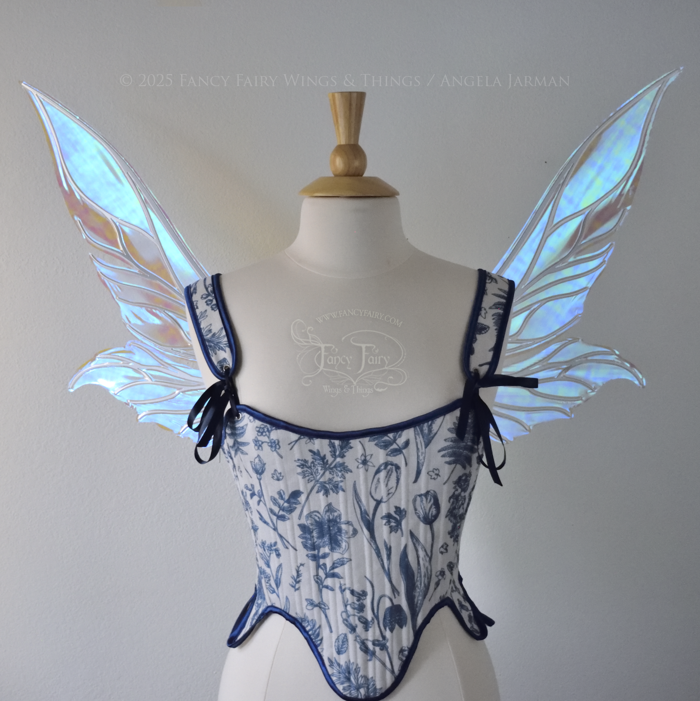 Iridescent & transparent elongated blue fairy wings with silver veins, front view, worn on dress form