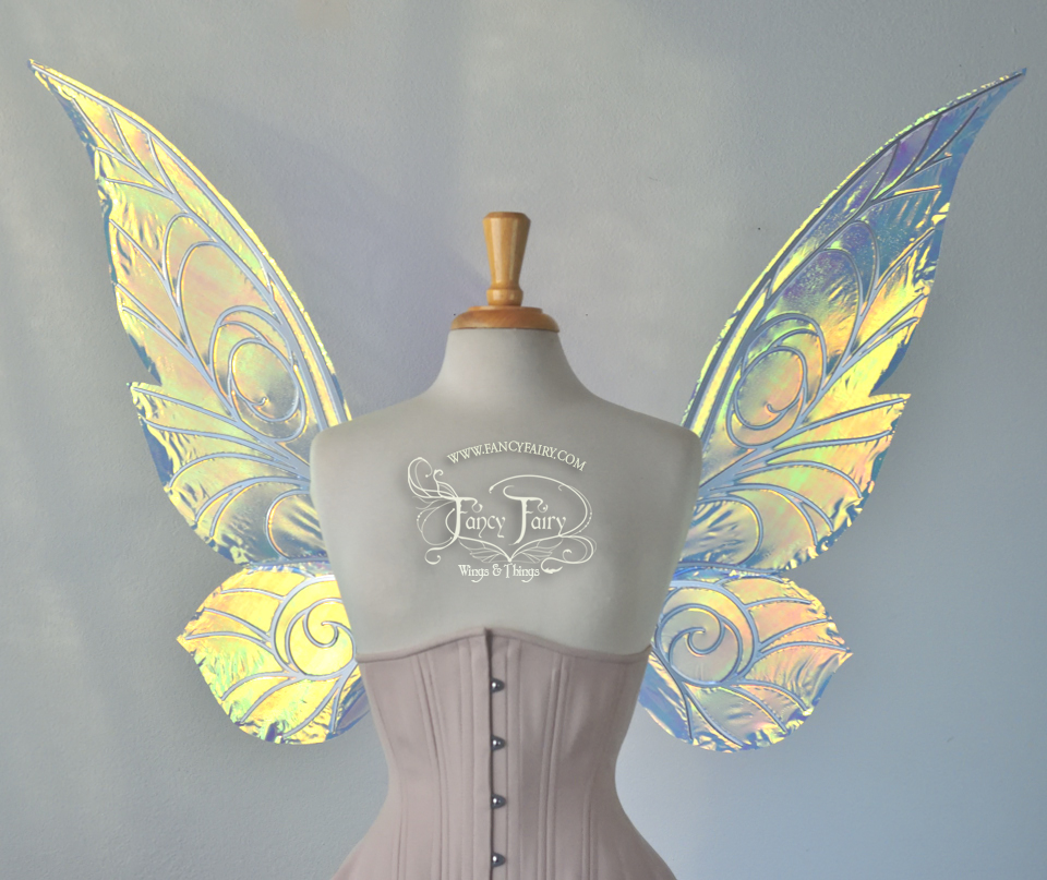 Front view of transparent green/yellow/orange  iridescent Tinker Bell inspired fairy wings with swirly white veins, displayed on a dress form